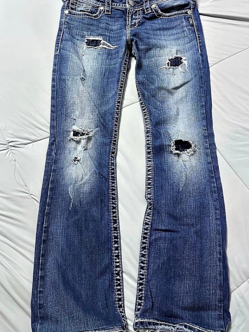 Silver Jeans Co. Pioneer Boot Cut Distressed Jeans. Boot Cut Jeans Blue Waist